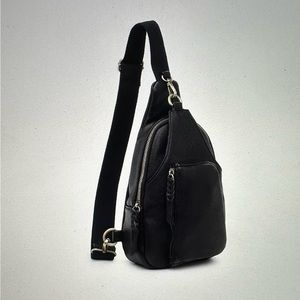 Like new Woman’s urban expressions sling backpack